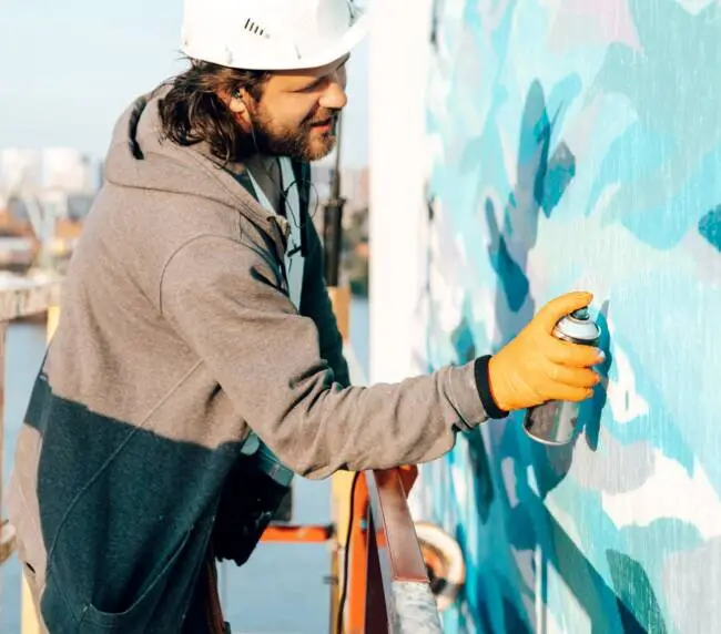man painting wall